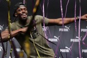 Bolt, en un acto promocional, este martes en Londres.-AFP / ADRIAN DENNIS