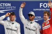 Nico Rosberg, Lewis Hamilton y Sebastian Vettel, hoy, en Monza, tras la calificación del GP de Italia.-AFP / ANDREJ ISAKOVIC