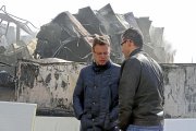 Los hermanos Rodríguez, delante del matadero completamente calcinado.-ICAL