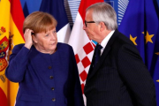 Merkel y Juncker al inicio de la cumbre informal sobre inmigración en Bruselas-REUTERS