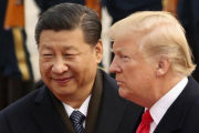 Xi Jinping y Donald Trump, en un encuentro en Pekín, el año pasado.-ANDREW HARNIK (AP)