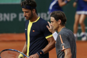 Ferrer y Feliciano, tras su partido del sábado en Roland Garros. El alicantino irá a Río, y el toledano ha renunciado por cuestión de calendario.-REUTERS / PASCAL ROSSIGNOL