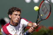 Pablo Carreño devuelve un golpe en la semifinal con Wawrinka.-EFE
