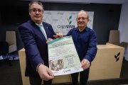 Germán Martínez Arcos (Fundación Caja Rural) y Luis Marcos Naviera (UBU) con el cartel de las jornadas.