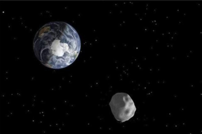 Imagen de una recreación distribuida por la NASA que representa el paso de un asteroide.-EFE