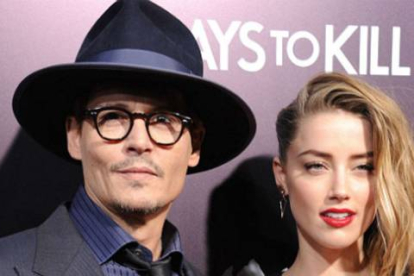 Johnny Depp y su ya esposa, Amber Heard, en una reciente 'premiere'.-Foto: AFP
