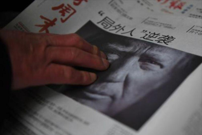 Trump, en la portada de un diario de Pekín.-AFP/GREG BAKER