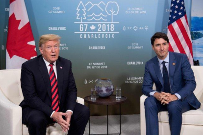 Donald Trump y Justin Trudeau.-AFP
