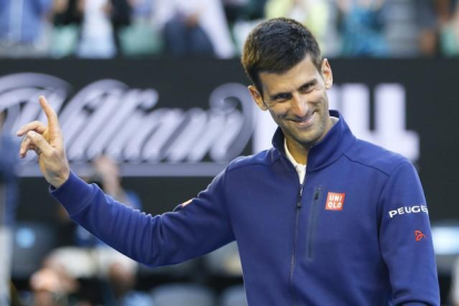 Novak Djokovic en el Grand Slam de Melbourne contra el francés Giles Simon.-EFE / MADE NAGI