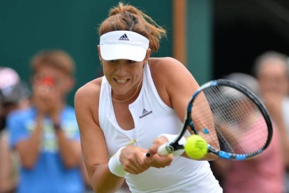 Muguruza, en un momento de su partido ante Lucic.-Foto: AFP / GLYN KIRK