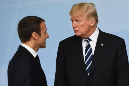 Donald Trump y Emnauel Macron durante las rueniones del G20 de la pasada semana en Hamburgo.-SAUL LOEB