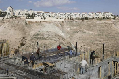 rabajos de construcción de viviendas en el asentamiento israelí de Maale Adumim, en Jerusalén este.-