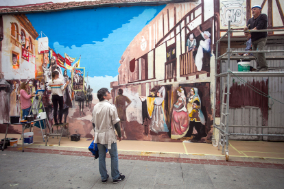 El mural, creado por catorce artistas, representa el retorno del Cid a la capital burgalesa y se ubica en La Puebla. TOMÁS ALONSO