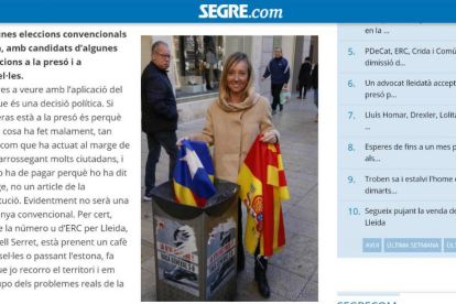 Caputra de pantalla de la entrevista en formato digital en la que la candidata por Lleida del PP, Marisa Xandri, se fotografió lanzando una estelada a la papelera.-/ ÒSCAR MIRÓN (SEGRE.COM)