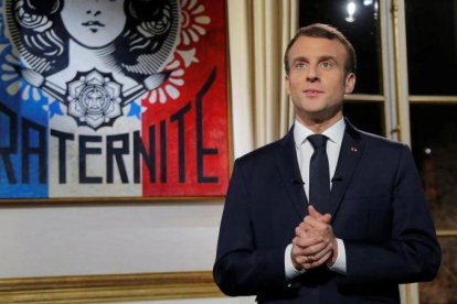 El presidente francés durante su mensaje de Fin de Año.-REUTERS / MICHEL EULER