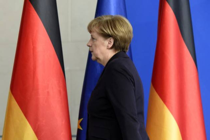 Angela Merkel tras la comparecencia.-Foto: TOBIAS SCHWARZ / AFP