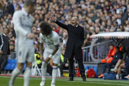 Marcelo, durante el partido del sábado ante el Málaga en el que cayó lesionado.-AP / FRANCISCO SECO