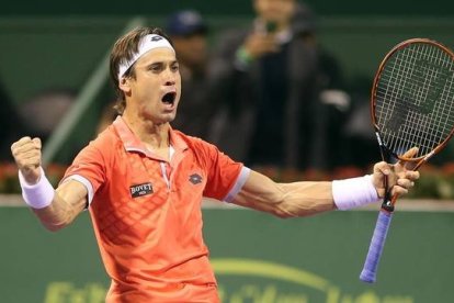 Ferrer celebra el pase a la final de Doha tras derrotar a Karlovic.-Foto: AFP / KARIM JAAFAR