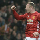 Wayne Rooney celebra el gol contra el Reading con el que iguala la marca histórica de Bobby Charlton con el Manchester United.-AFP / OLI SCARFF