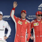 Valtteri Bottas (2º), Sebastian Vettel (1º) y Kimi Raikkonen (3º), en los últimos ensayos hoy del GP de Alemania. /-AP / JENS MEYER