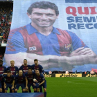 Homenaje a Quini en el Camp Nou.-AFP / LLUIS GENE