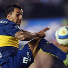 Tévez, en un partido con el Boca Júniors.-EFE / JUAN IGNACIO RONCORONI