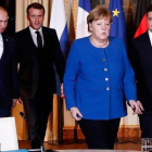 Putin, Merkel, Macron y Zelensky, antes de empezar la reunión en París.-IAN LANGSDON / POOL AFP