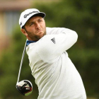Jon Rahm, en acción, en una última vuelta en Pebble Beach-ROSS KINAIRD (AFP)