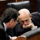 Soria y Wert comparten confidencias en el debate del Estado de la Nación, el pasado febrero.-JOSÉ LUIS ROCA
