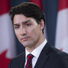 Canadian Prime Minister Justin Trudeau listens to a question during an end of session news conference in Ottawa-CANADIAN PRESS