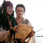Johnny Depp y Orlando Bloom protagonizan  la segunda entrega de 'Piratas del caribe' .-