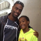 El atleta Tyson Gay y su hija, Trinity.-