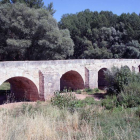 Puente romano sobre el Arlanza a su paso por la localidad.-MIGUEL ÁNGEL