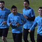 Nacho, Casemiro, Keylor Navas y Cristiano Ronaldo, en el entrenamiento del Madrid este jueves.-AP / HASSAN AMMAR