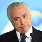 Las autoridades investigan si un decreto sancionado por Temer en 2017 y que alteró la ley de puertos benefició a algunas empresas del sector.-AFP