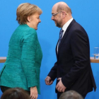 Angela Merkel y Martin Schulz, tras la rueda de prensa de presentación del acuerdo de gobierno, en Berlín.-AFP / KAY NIETFELD