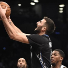 Ricky Rubio, durante una acción del encuentro ante los Nets.-AP / KATHY KMONICEK