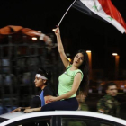 Aficionados sirios celebran el empate ante Irán.-AFP / LOUAI BESHARA