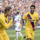 Griezmann y Suárez festejan uno de los goles azulgranas.-