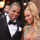 Una foto de archivo de beyoncé y su marido, Jay Z. En la derecha, la diseñadora Rachel Roy.-AP / MIKE COPPOLA