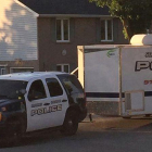 Una patrulla de la policía y una ambulancia, durante la operación antiterrorista en Strathroy (Ontario), este miércoles.-REUTERS / STRINGER