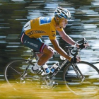Lance Armstrong con el jersey amarillo y la publicidad de US Postal.-