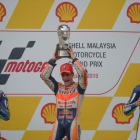 Pedrosa celebra su victoria en el GP de Malasia, en la que Lorezo ha acabado segundo y Rossi, tercero.-AFP