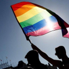 Una bandera arcoíris ondea durante el desfile del Orgullo de Madrid, este sábado.-EFE / MARISCAL