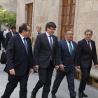 Jordi Jané, Carles Puigdemont, Juan Ignacio Zoido y Enric Millo, en el Pati dels Tarongers de la Generalitat, en julio.-JULIO CARBÓ