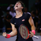 Carla Suárez, eufórica tras batir a Venus Williams en cuartos de final del torneo de Miami.-Foto: AFP / AL BELLO
