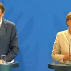 Rajoy y Merkel, durante la rueda de prensa conjunta de este martes.-