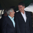 Brazil s President-elect Jair Bolsonaro waves at supporters as he arrives to watch an aerial performance by the private pilots  group a  Esquadrilha do Ceu  or a  Sky Squadron   at Barra beach in Rio de Janeiro  Brazil .-Leo Correa  / AP