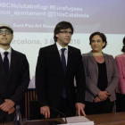 Albert Royo, Carles Puigdemont, Ada Colau y María Jesús Vega en el Forum internacional sobre acogida e integración de personas refugiadas de la Unión Europea, en Barcelona.-JULIO CARBO
