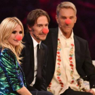 Heidi Klum, y los miembros del jurado del concurso 'Next Top Model', Thomas Hayo y Wolfgang Joop, poco antes de que el 'show' fuese suspendido por una amenaza de bomba.-Foto: AFP